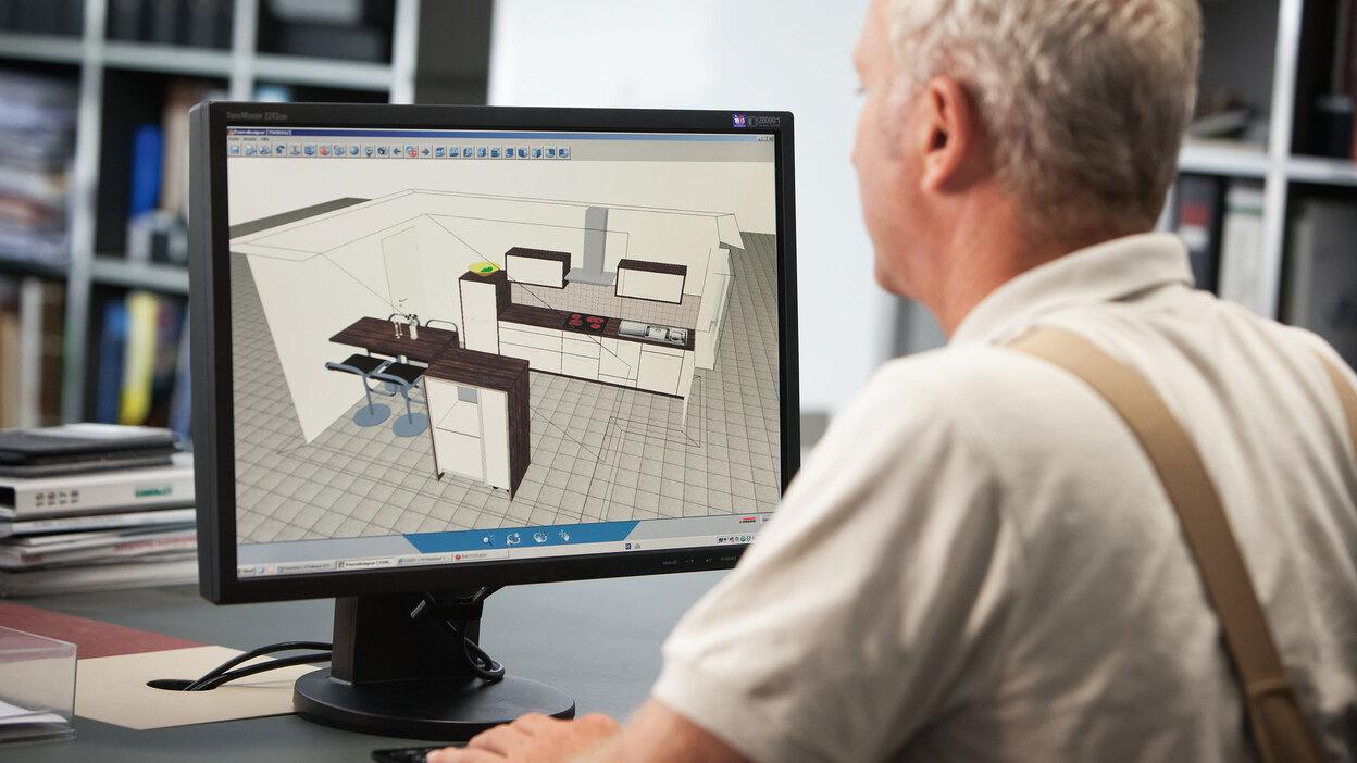 Planungsdarstellung einer Küche in 3D am Computer durch Tischler